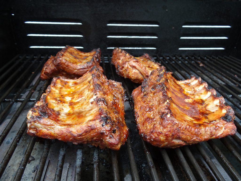 Pork ribs on the grill, tender and juicy with a crispy, caramelized crust.