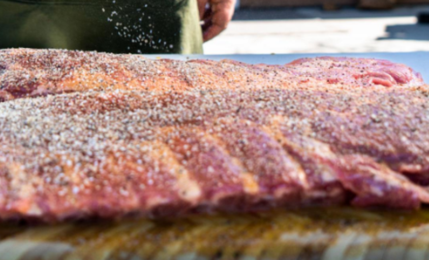 Coat the raw pork ribs with dry rub.