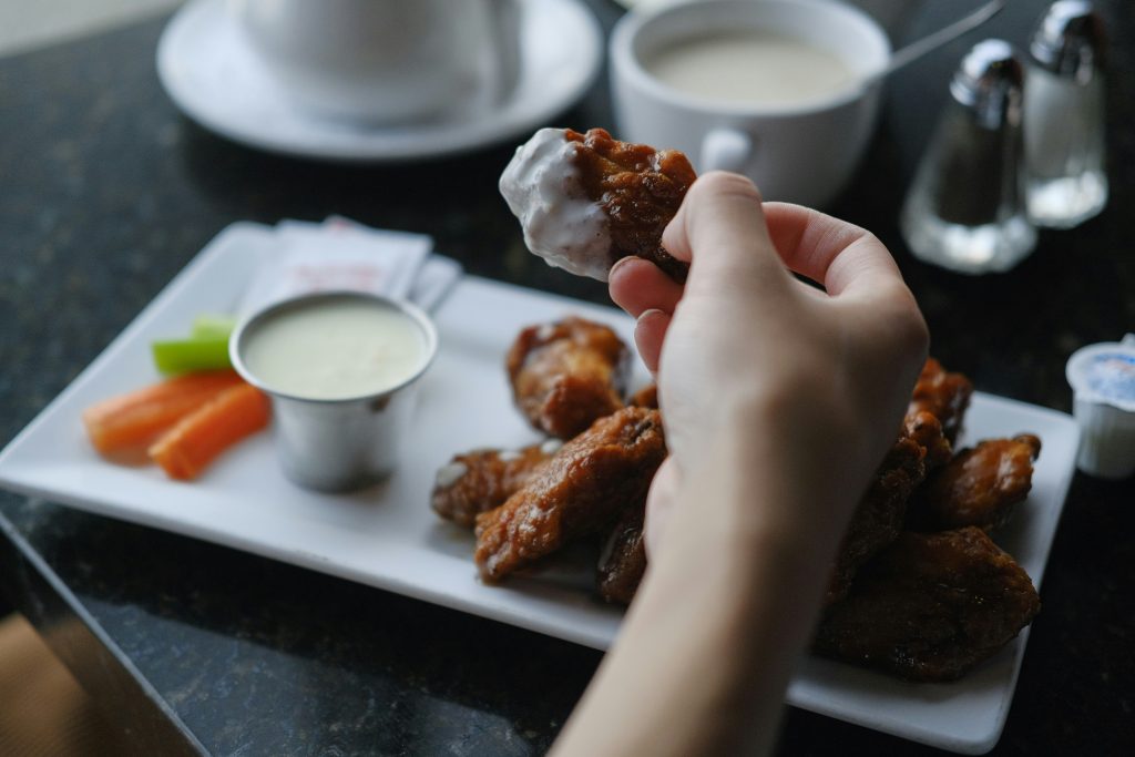 Buffalo Wings with blue cheese dip and celery